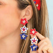 star patriotic earrings in ear
