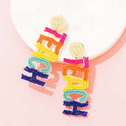 multi teacher earrings on marble dish