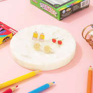 gold teacher earring set on marble dish