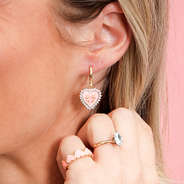 rhinestone heart earrings in ear