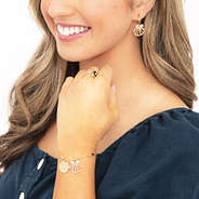 shell bracelet set on arm and ear