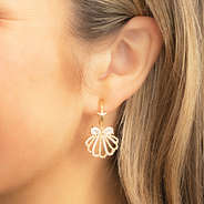 gold shell bracelet set earrings in ear