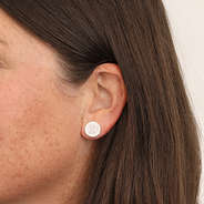 heart necklace earring in ear