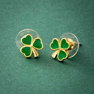 shamrock earrings on green paper