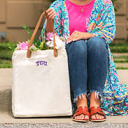 tcu horned frogs ivory canvas tote on sidewalk