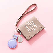 Lavender airtag keychain on card wallet wristlet