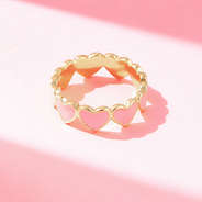 heart ring on pink paper