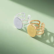 duo of statement rings on sage