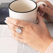 statement ring in silver and coffee mug