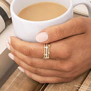 cable stack rings in gold and silver with coffee