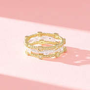 close up of silver and gold cable stack ring