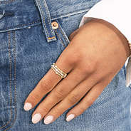 gold and silver cable stack rings on finger