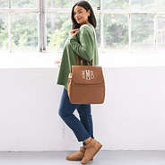 girl with monogrammed diaper backpack purse over shoulder