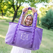 purple anywhere tote bag held up by ava