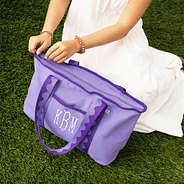 purple anywhere tote bag on grass