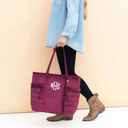 burgundy pocket tote bag in hand