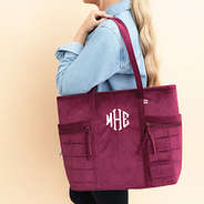burgundy pocket tote bag on shoulder