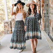girls wearing black paisley skirt and dress