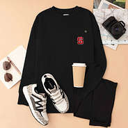 north carolina state wolfpack black crewneck sweatshirt flatlay