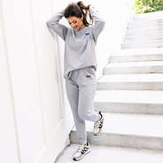girl wearing monogrammed heathered grey joggers and sweatshirt