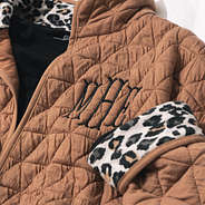 close up of quilted coat monogram