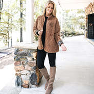 girl wearing monogrammed quilted coat in almond