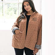 girl wearing personalized quilted coat in almond with leggings