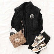 black oversized sherpa vest flatlay