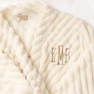 up close of monogram on plush robe