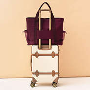 monogrammed carry on tote in burgundy luggage strap