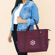 personalized carry on tote in burgundy over arm
