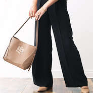 monogrammed bucket bag in taupe in arms