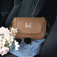 crossbody bag in brown in car