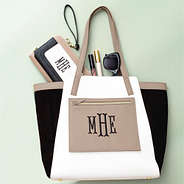 black colorblock tote bag with phone wallet wristlet flatlay