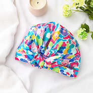 watercolor cheetah reusable shower cap flatlay