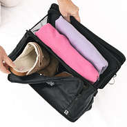 personalized hanging packing organizer being packed with clothes