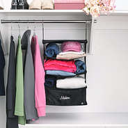 monogrammed hanging packing organizer in black on closet rack