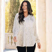 close up of girl wearing monogrammed softspun pullover in snow leopard