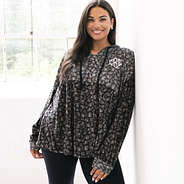 girl wearing onyx leopard monogrammed softspun pullover