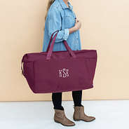 burgundy woodland blossom foldover weekend bag on arm