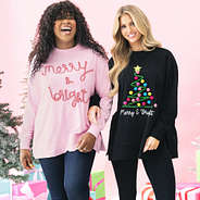 girls wearing light pink and black merry and bright sweatshirts