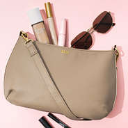 close up of monogrammed foil shoulder bag