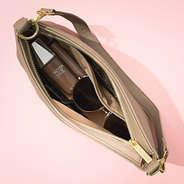 inside of tan shoulder bag