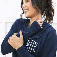 close up of girl wearing personalized knit sweater jacket in navy blue