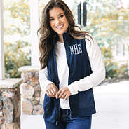 girl wearing monogrammed lightweight vest in navy