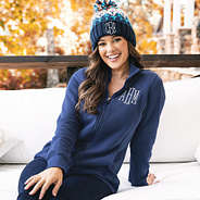 girl wearing mock neck monogrammed navy jacket