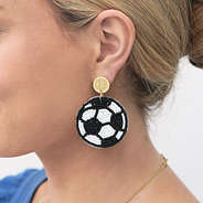 monogrammed soccer earring in ear