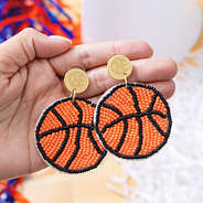 basketball personalized earrings in hands
