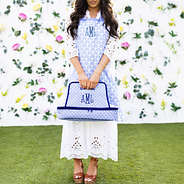 blue shells casserole carrier in hands with apron