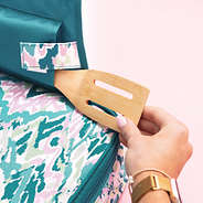 close up of bermuda ikat monogrammed casserole carrier with spoon